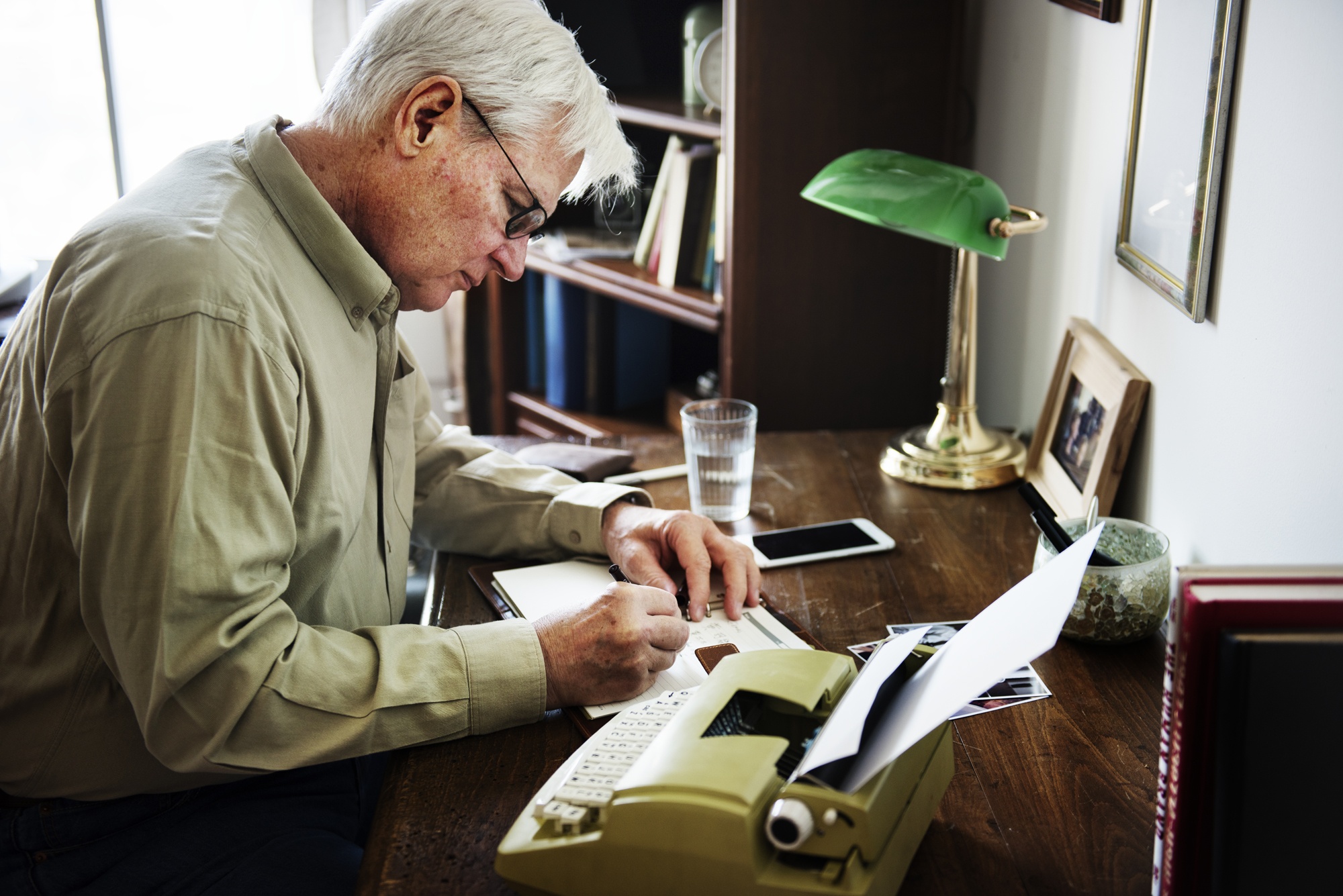 Senior man writing